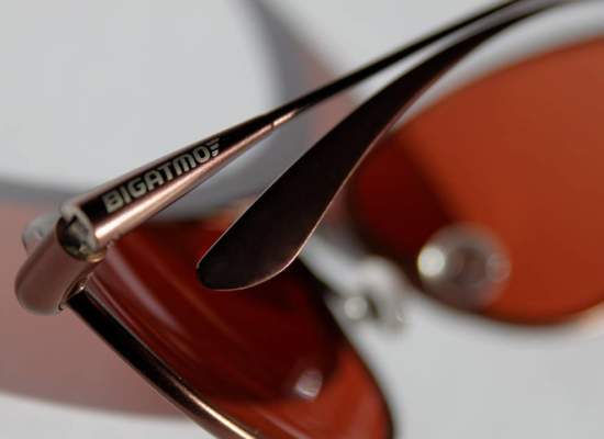 Folded sunglasses showing Bigatmo logo on temple arm